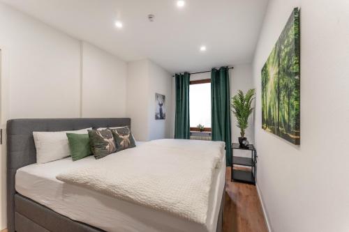 a bedroom with a bed and a window at Kathihomes Zentral in Villingen-Schwenningen