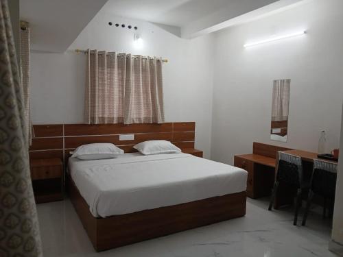 Giường trong phòng chung tại AVSS Cottage Munnar