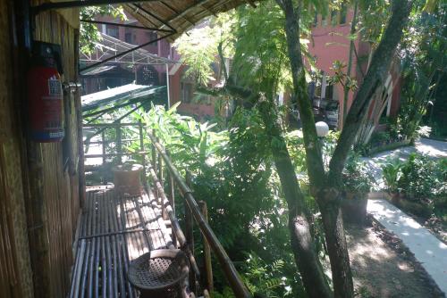 an outside area of a building with a tree at Hilltop Lodge in Guwahati