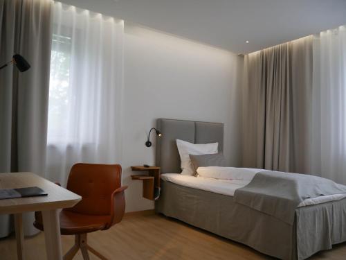 Säng eller sängar i ett rum på Hotel am Engelberg