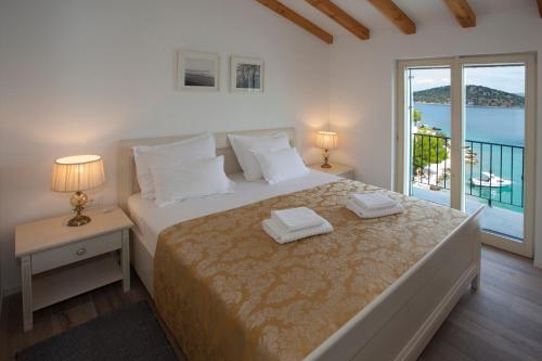Ένα ή περισσότερα κρεβάτια σε δωμάτιο στο Villa Perun