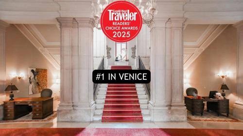 a stairway with a sign that reads k invenue at San Clemente Palace Venice in Venice
