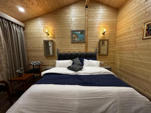 A bed or beds in a room at Badri Resort Mana, Badrinath