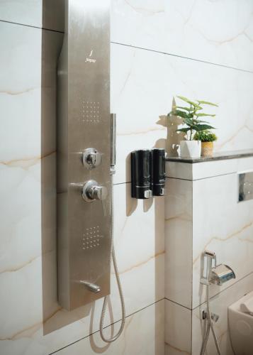 a shower in a bathroom with a shower at Hotel Maya Elite in Bhopal