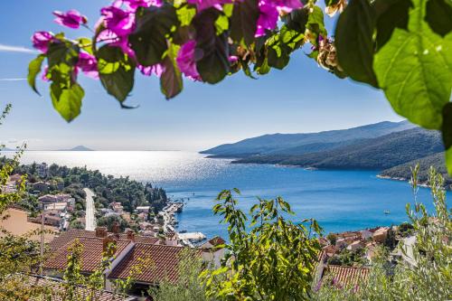 a view of a town and a body of water at Apartment Neda in Rabac - Bay View in Rabac