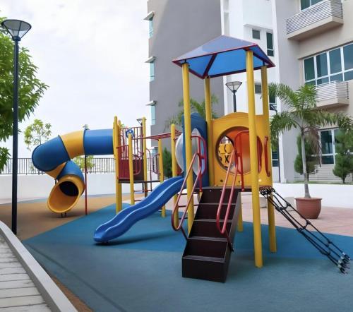 a playground in front of a building at J Cozy Stay - 3B 2B, Fair Park Ipoh in Ipoh