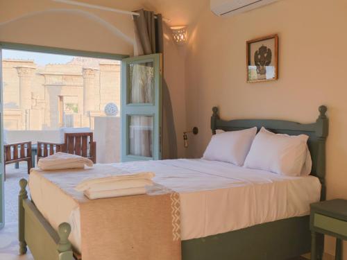Ένα ή περισσότερα κρεβάτια σε δωμάτιο στο Habu Hotel