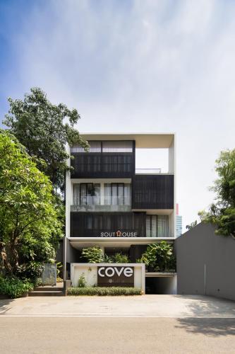 a building with a cvo sign in front of it at Cove Southouse Residence in Jakarta
