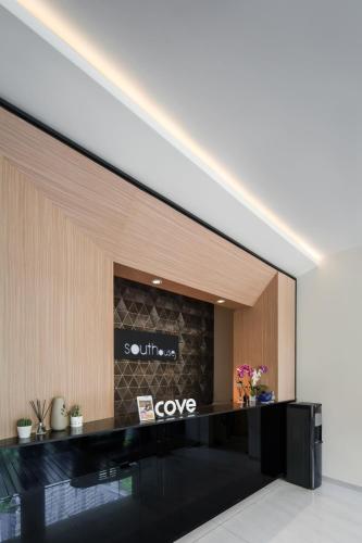 a lobby with a love sign on the wall at Cove Southouse Residence in Jakarta