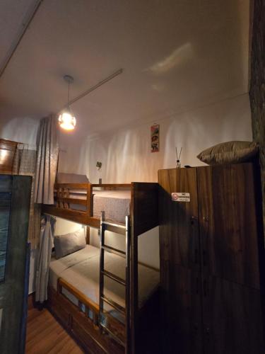 a room with three bunk beds in a room at Narjiss Hostel in Fès