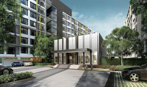 an architectural rendering of a building with a parking lot at Sukhumvit 50 apartment in Bangkok