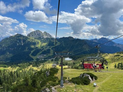 a gondola ride in the mountains with mountains at Alpine Oasis in Hermagor