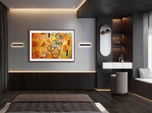 a bathroom with a painting on the wall at Hotel The Grand Olive Aero Suites Near Delhi Airport in New Delhi
