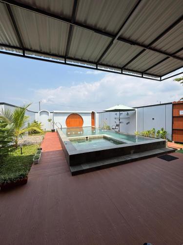 a house with a swimming pool on a patio at Lora House in Sukoharjo