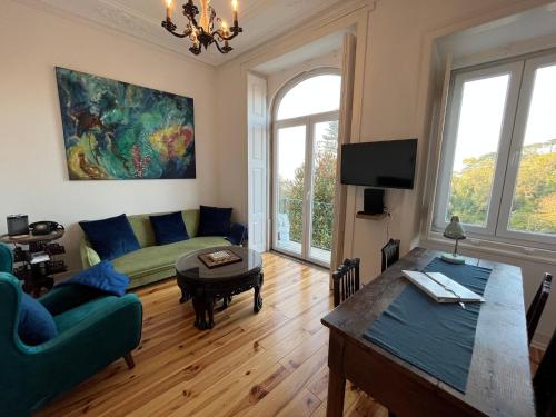 a living room with a couch and a table at Casa Didi - 3km do centro - by Trip2Portugal in Sintra