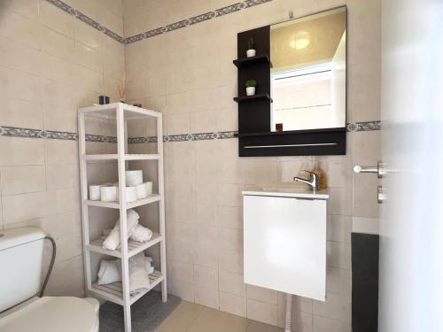 a bathroom with a toilet and a sink at Countryside Home by Trip2Portugal in Sobral da Abelheira