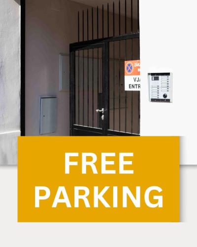 a gate with the words free parking in front of it at Hotel MAXPLAZA in Trnava
