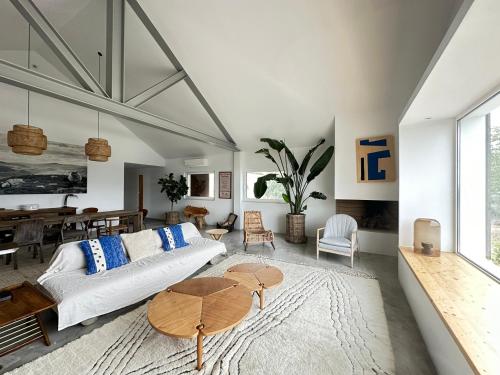 a living room with a couch and a table at Fazenda do Pomar by Trip2Portugal in Montemor-o-Novo