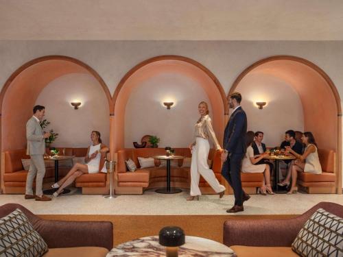 a group of people in a hotel lobby at Manly Pacific Sydney MGallery Collection in Sydney