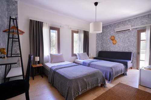 Ένα ή περισσότερα κρεβάτια σε δωμάτιο στο Kalkan Ayapa Hotel