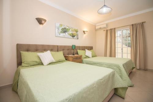 En eller flere senge i et værelse på Villa Panoramica