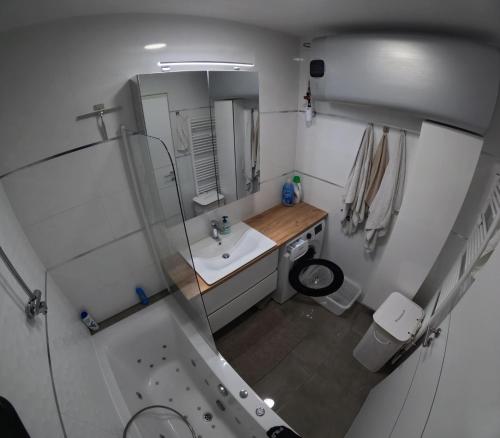 a small bathroom with a sink and a mirror at Alpine Oasis in Hermagor