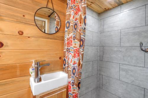 a bathroom with a sink and a shower at Arbor House of Dripping Springs - Harmony Hollow in Dripping Springs