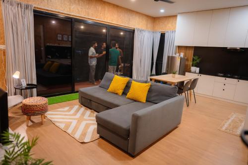 a living room with a couch and a table at Ginger Villa Farmstay, Thodupuzha in Idukki