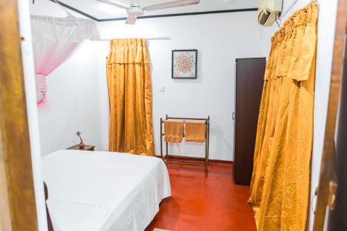 Postel nebo postele na pokoji v ubytování Su Casa Bentota
