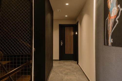 a hallway with a door to a wine cellar at Pou by Seaward Suites in Villajoyosa