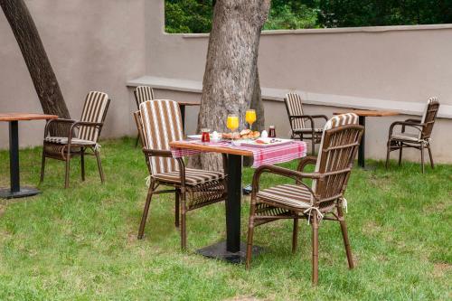 a table and chairs sitting in the grass at Element Garden in Istanbul