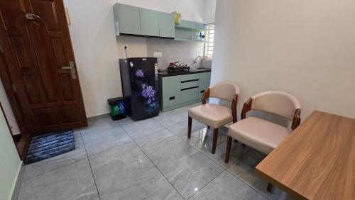 Kuchyň nebo kuchyňský kout v ubytování Olive Inn Apartment