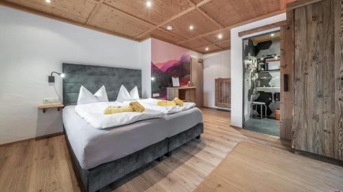 a bedroom with a large bed in a room at LandererMühle in Lenggries
