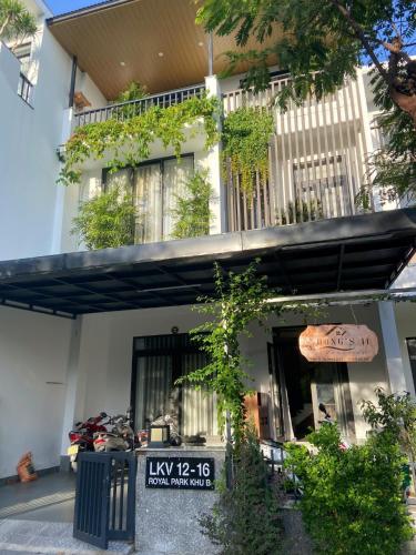 a building with a sign in front of it at Rong's 2 Homestay Huế in Hue