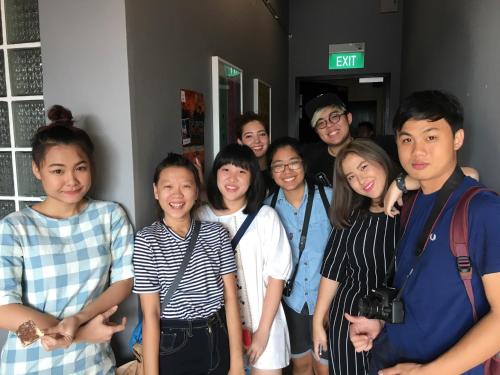 a group of people posing for a picture at BEAT. Capsule Hostel @ Boat Quay in Singapore