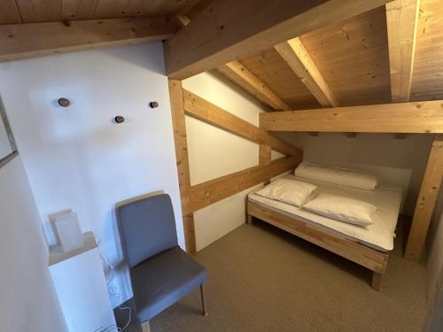 En eller flere senge i et værelse på Magnifique chalet Arcs 1600