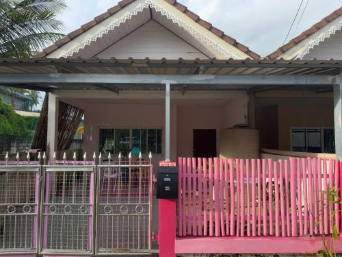 a pink fence in front of a house at Aonang Private Pink House 8 in Ao Nang Beach