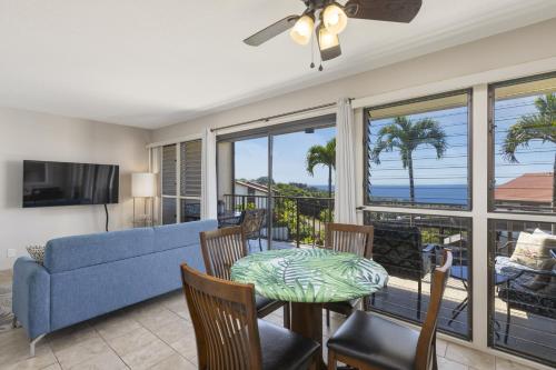 a living room with a couch and a table at Kona Coffee Villas E246 condo in Honalo