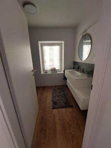 a bathroom with a sink and a mirror at Gemma del Lagorai in Torcegno