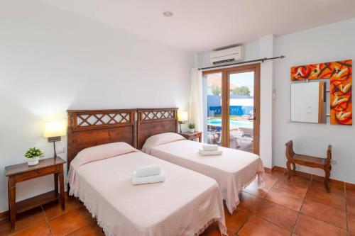 En eller flere senge i et værelse på Villa Silvia II by Villa Plus