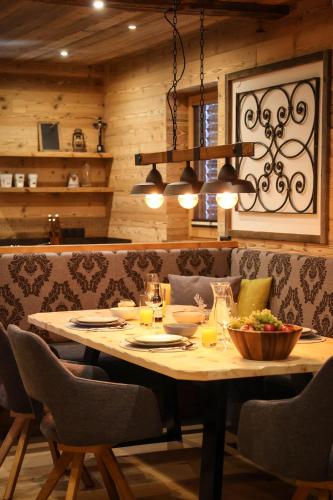 a dining room with a table with a bowl of food at Chalet Gipfelsturm in Haus im Ennstal