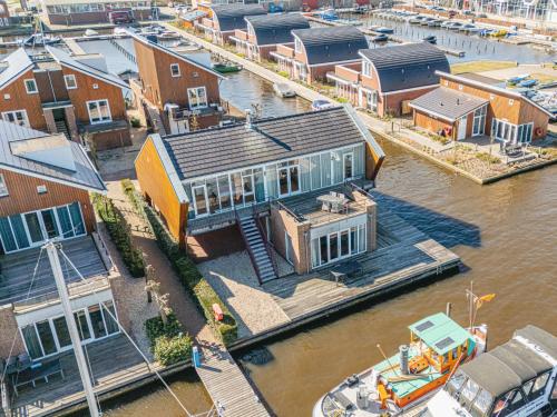 an aerial view of a house on the water at Apartment Penthouse by Interhome in Uitgeest