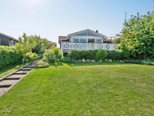 a yard with a house in the background at Holiday Home Elfrede - 600m from the sea by Interhome in Kerteminde