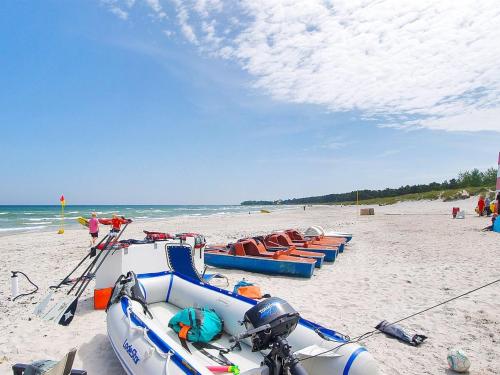 a row of boats on a sandy beach at Holiday Home Alica - 200m from the sea by Interhome in Neksø