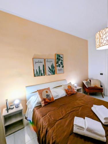 a bedroom with a large bed with pillows on it at Incoming Quartieri Spagnoli in Naples