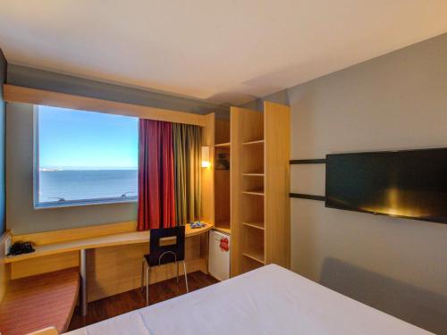 Postel nebo postele na pokoji v ubytování ibis Vitoria Praia de Camburi