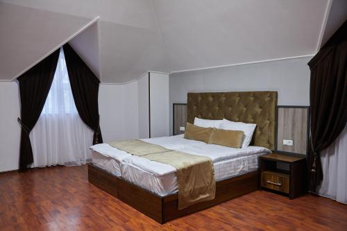 Postel nebo postele na pokoji v ubytování Elite art hotel