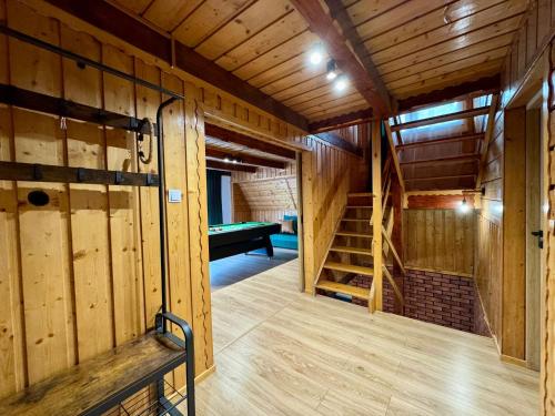 an inside view of a room with a pool table at Willa Widokowa - balia, sauna, basen, bilard in Międzybrodzie Bialskie
