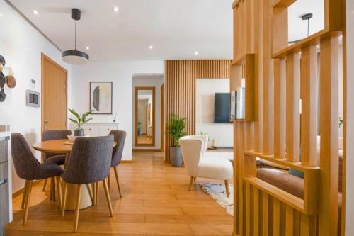 a kitchen and dining room with a table and chairs at La Terrazza at Marina - By AppartAli in Casablanca-Port