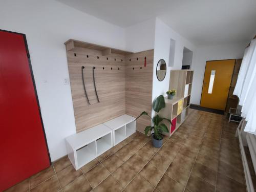 a room with a bench and a wall at Hotel Squash House in Prievidza